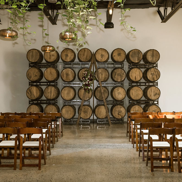 warmly lit hall with wodden furniture and arbor